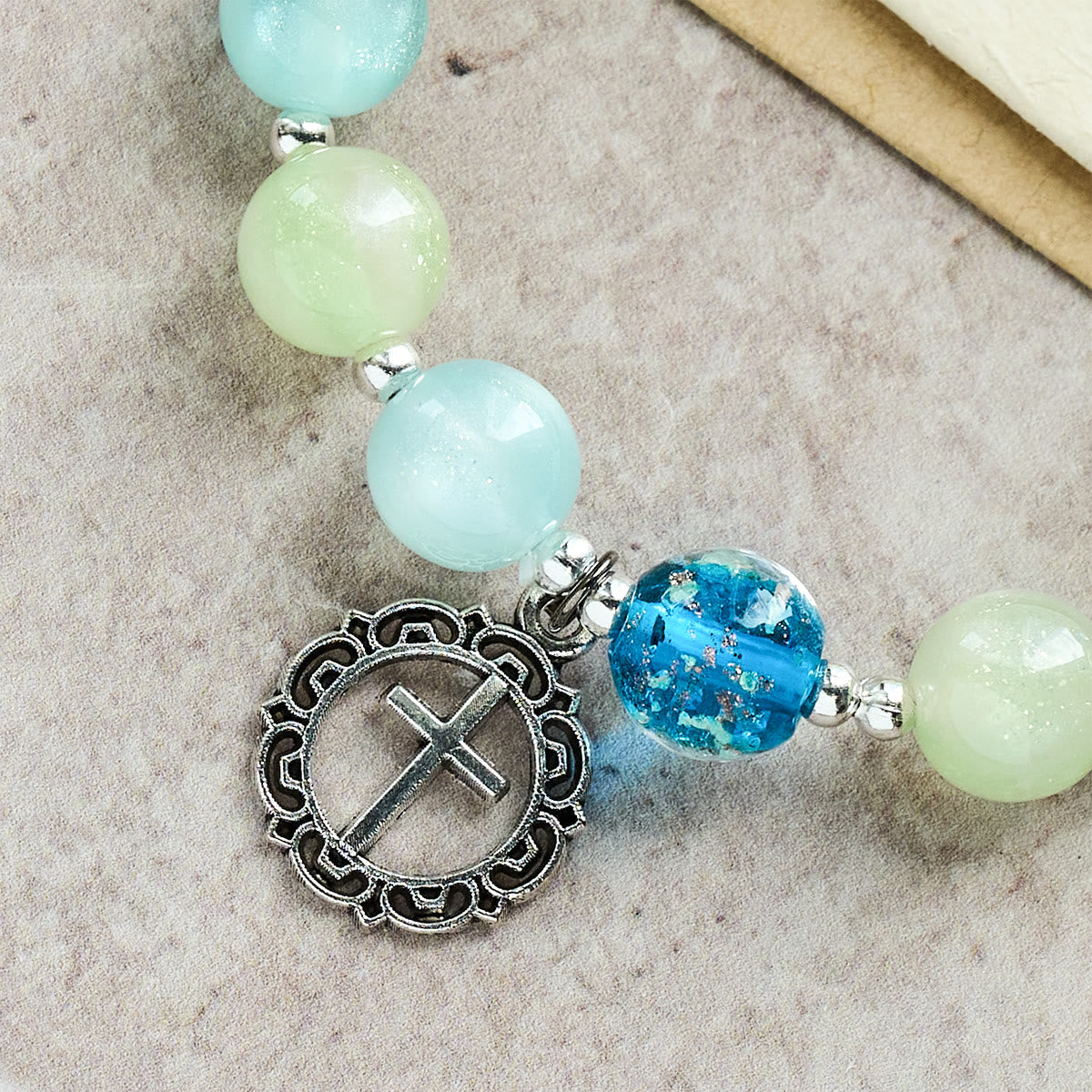 UV-Changing Glitter Bead Bracelet with Ornate Cross