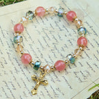 Pink Crystal & Multi-Faceted Bead Bracelet with Golden Crucifix