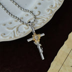 Silver-Toned Cross Pendant Necklace with Golden Floral & Leaf