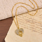 Zircon-Encrusted Heart Cross Necklace with Angel Wings